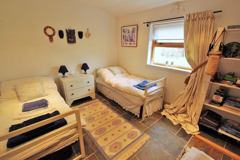 DRESSING ROOM With window to the front elevation, 2 built-in double wardrobes,