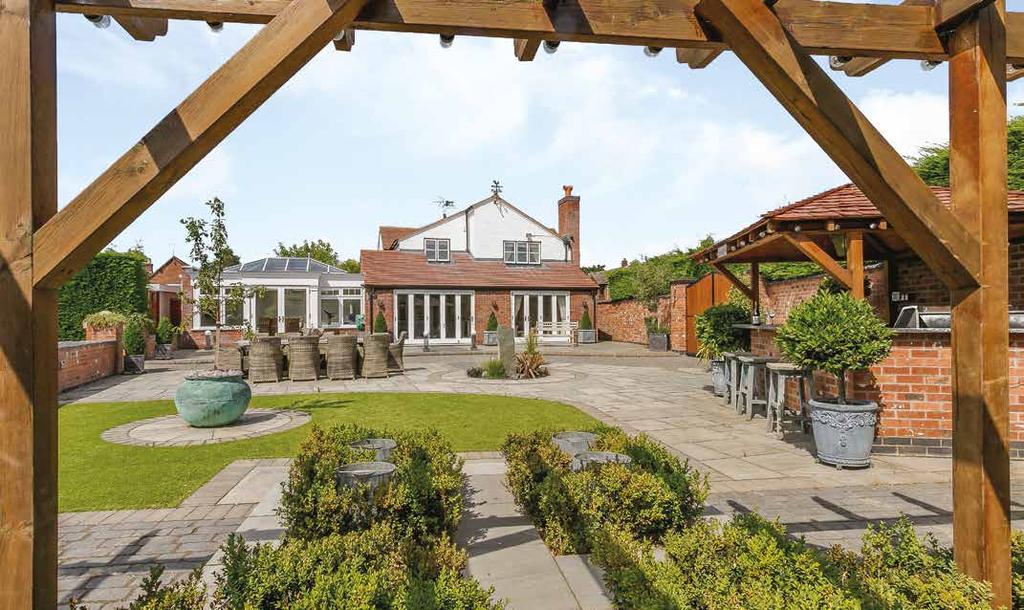 Outside The beautiful south facing private gardens lead down to the River Itchen and the separate paddock of just under an acre beyond, this can be accessed from the Bascote Road.