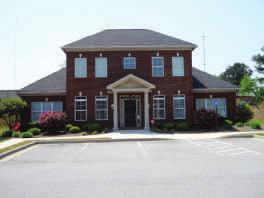 office building for sale excellent location in Suwanee, GA. Convenient to Peachtree Industrial Blvd, Lawrenceville Suwanee Rd & McGinnis Ferry Rd.