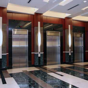 The lobby features granite floors, wood paneled walls, and a 13½ -15½ clear ceiling. The building is served with one revolving door and one vestibule entrance.