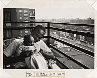 Leonard Freed, American, 1929 2006 Sociology student with his 3 month old daughter on the balcony of his apartment, Harlem, New York City,