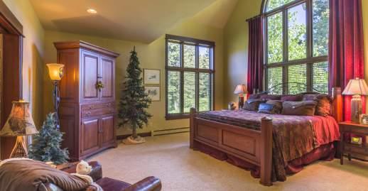 On the south side of the home the carpeted Master Suite has the same two-story vaulted and