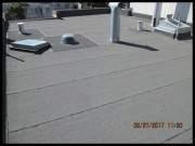 The roof covering material is in a condition that is consistent with its age and method of installation, showing no deficiency or cause for immediate concern.