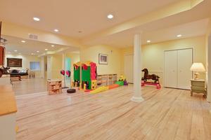 Finishes include low maintenance wood laminate flooring and recessed lighting.
