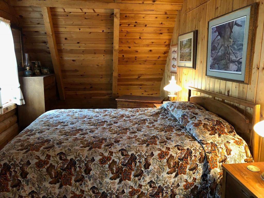 Master bedroom sleeping area and wood stove