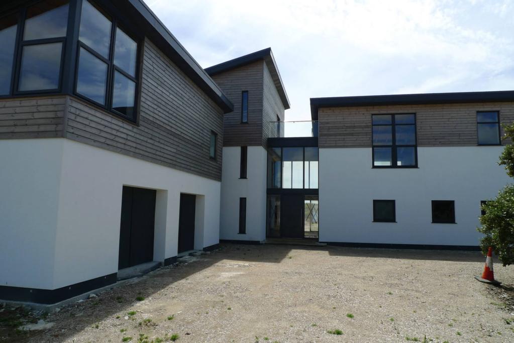 A part-built large modern home offering stunning panoramic views of St. Michaels Mount and Mount's Bay.