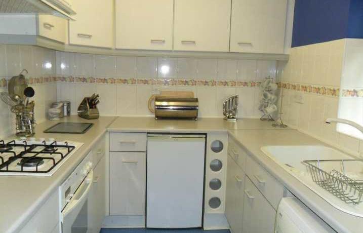 room including furniture, fitted kitchen including electrical appliances, bedroom with