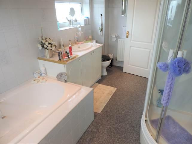 Bathroom: Large space as third bedroom added comprising of vanity sink unit, WC, bath, walk in shower cubicle,