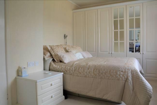 35m) Including range of built -in bedroom furniture comprising wardrobes, bedside cabinets, drawers and dressing table, double radiator,