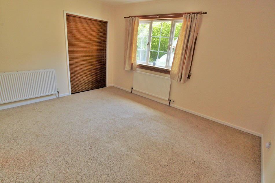 wardrobe, fitted carpet, & door leading to the Shower Room. SHOWER ROOM 1.8m x 1.