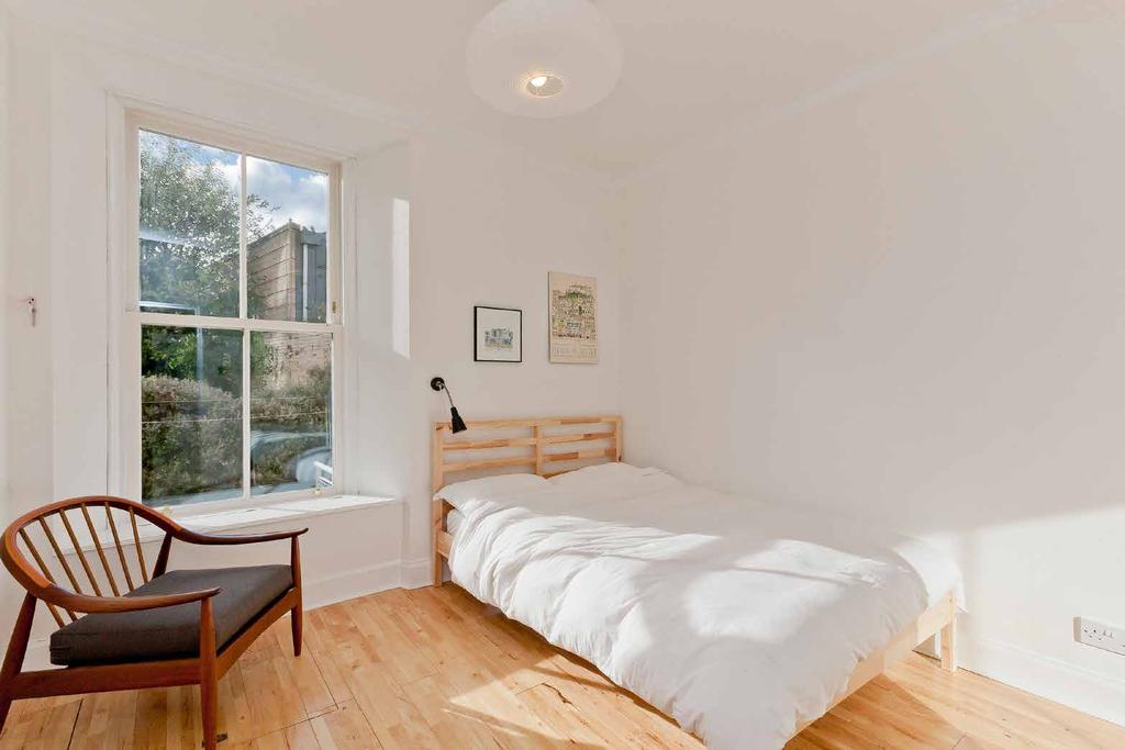 .. Enjoying a tranquil, southwesterly aspect overlooking the leafy rear garden, both double bedrooms boast magnificent  The