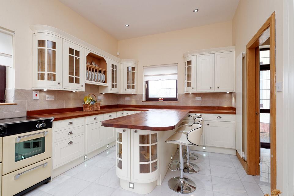 of cream shaker style solid oak doors to an ample