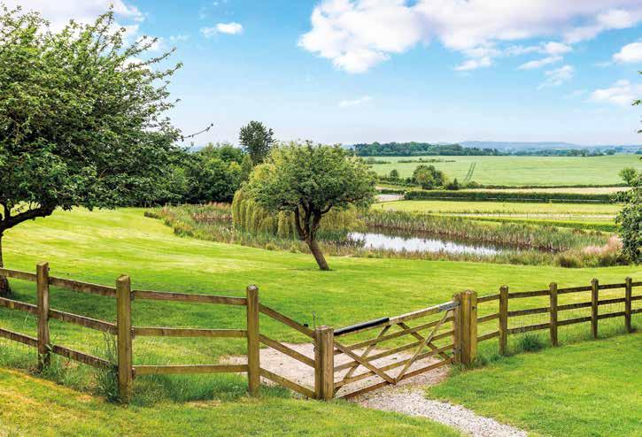Outside The well presented property is approached off a quiet lane, via a splayed walled entrance with a triangular green leading to ornate automated steel gates supported by Hamstone piers, which