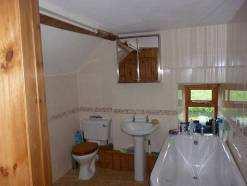 Family Bathroom With free standing bath, tiled walls, wash hand basin, low flush WC,
