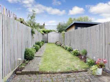 Rear Garden Paved patio area, lawn, shed, external power point, gated access to rear.