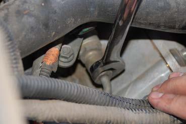 Remove fuel line with a 17mm flare nut wrench.