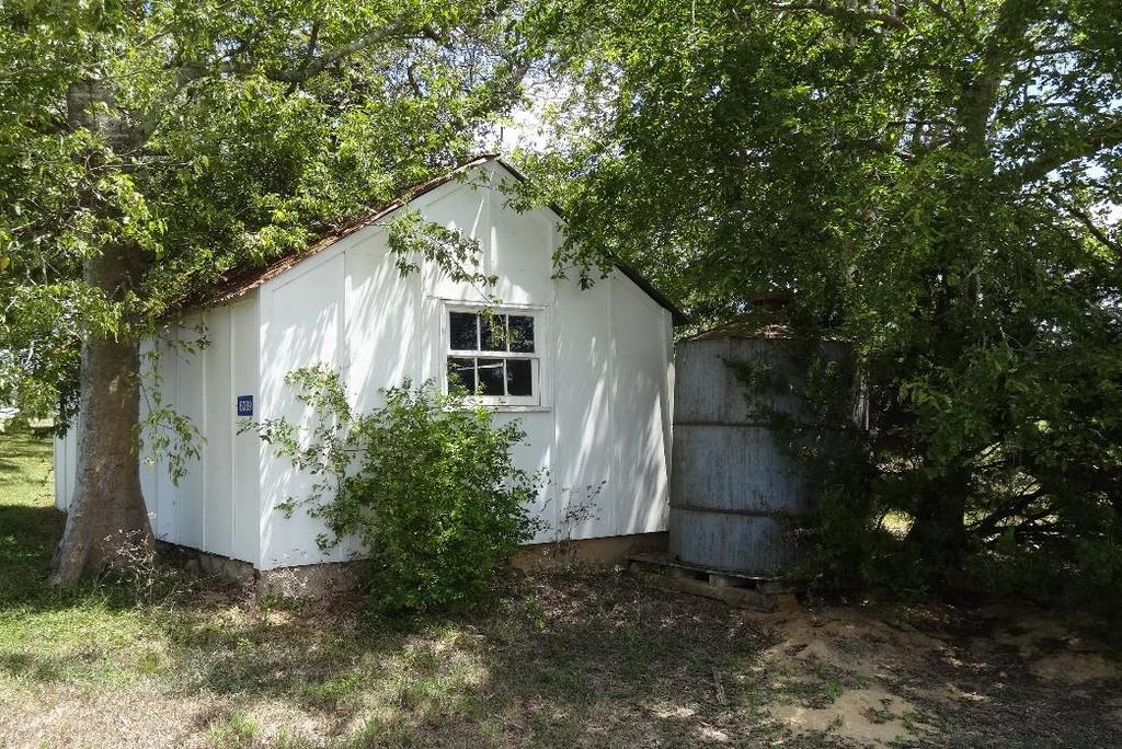 The old Texas Farm House sits in a grove of trees on top of the hill a few miles west of New Ulm. Built around 1910, the home is approximately 1200 sq. ft. living area.