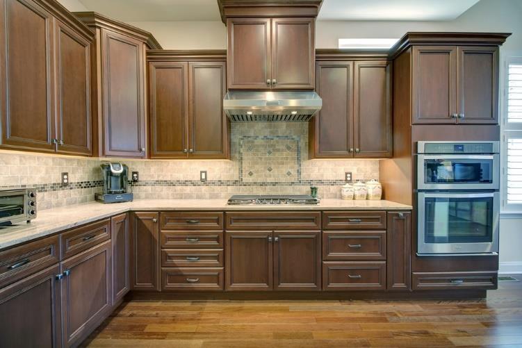 Kitchen: 24 X 16: A sunlit Kitchen with center island, breakfast bar and dining area features granite countertops, custom