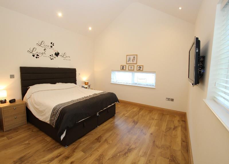The ground floor also offers a large double bedroom with vaulted ceiling, dressing room and en-suite, all