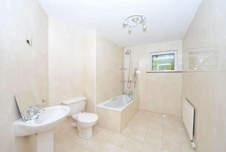 ENSUITE BATHROOM: Panelled bath with mixer taps and telephone hand shower. Low flush WC, pedestal wash hand basin. Ceramic tiled floor, fully tiled walls. Wall light wiring.