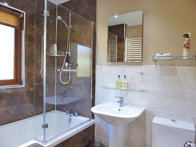 EN-SUITE SHOWER ROOM 1.70m x 1.40m (5 07 x 4 07 ) Lovely modern room with double door walk-in shower cubicle with wet wall finish.