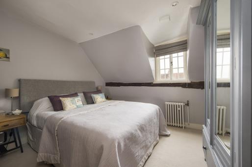 The room benefits from a heavily timbered ceiling, oak parquet flooring and French doors leading to a South and West facing terrace making it ideal for large scale family entertaining.