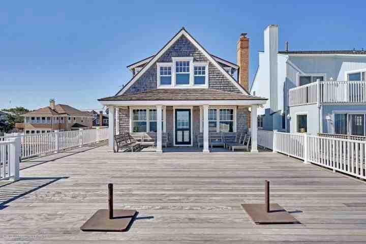 width deck with covered porch facing ocean Form