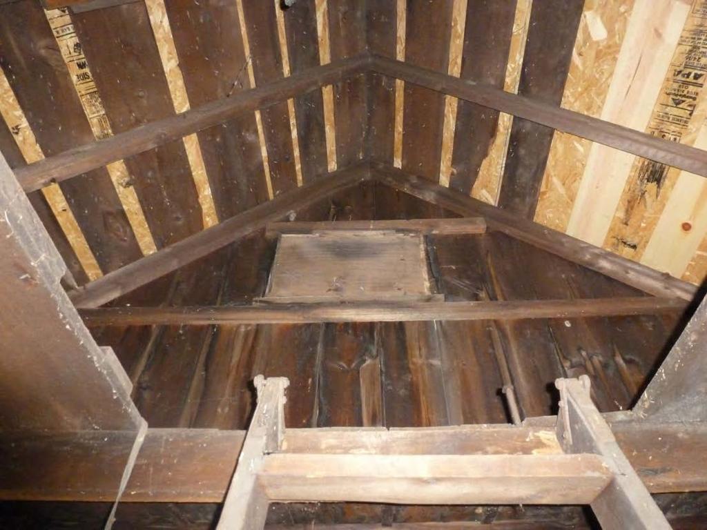 southwest. 20. Interior view of the north gable-end and rafters.