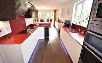 splash backs & a 1 ½ sink with mixer tap Integrated NEF electric hob & overhead extractor unit, dishwasher, microwave, electric double oven & a warming drawer & a fridge freezer Generous Sized Dining