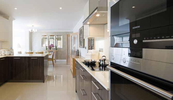 Kitchen Fully fitted contemporary kitchen by top German manufacturer, featuring: stainless steel extractor hood, ceramic hob, integrated oven, fridge freezer, dishwasher and microwave.
