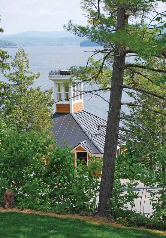 Left: The view from the home s front yard overlooks the charming two-story boathouse and the lake beyond.