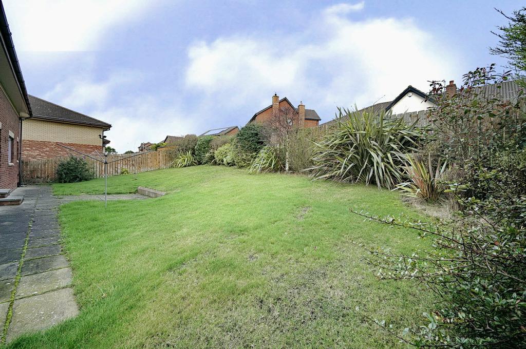 Front garden laid out in lawns. Enclosed and fenced rear garden laid out in lawns and shrubs.