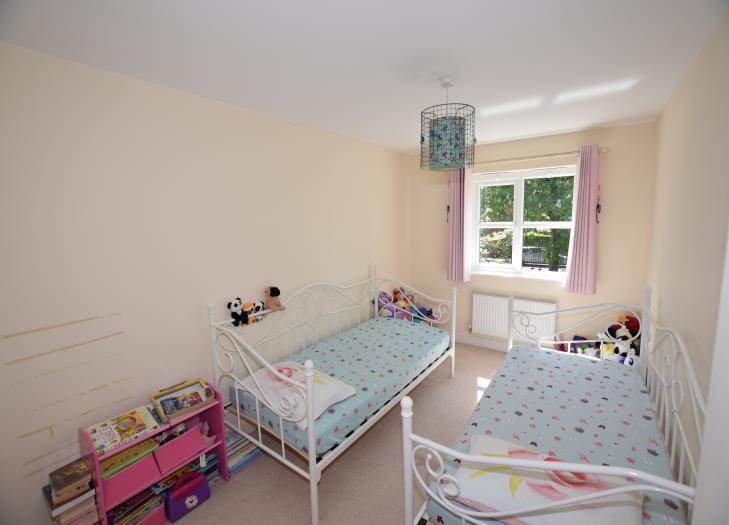 Bedroom Four 13' 1'' x 8' 6'' (4.00m x 2.58m) Built in wardrobes. Central heating radiator.