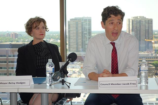 MinnPost photo by Peter Callaghan Mayor Betsy Hodges listened as Council Member Jacob Frey touted the mixed-use nature of the plan as a break from the "old model of city planning.