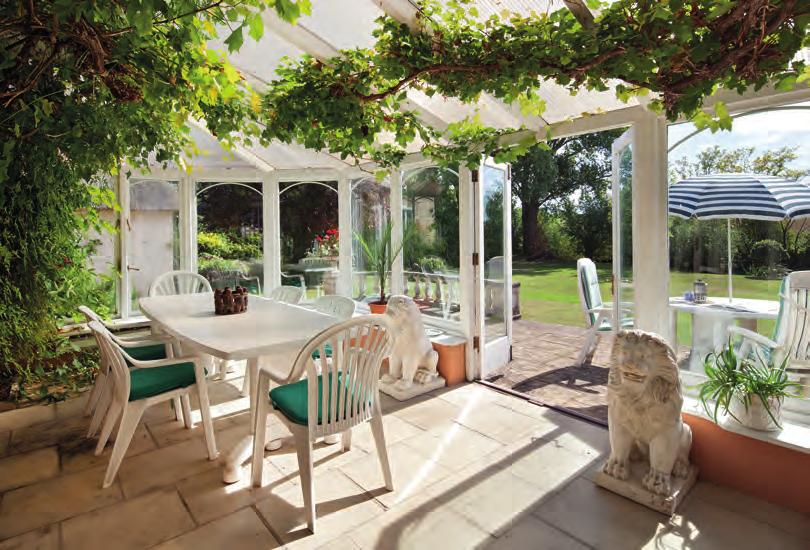 A large 34 drawing room is ideal for entertaining which opens on to a conservatory which overlooks the garden and river.