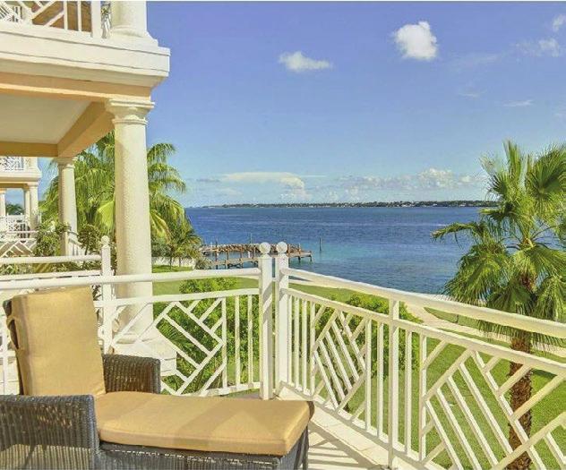Panoramic views of the ocean and golf course make this residence shine. State-of-theart appliances and luxury furnishings sweeten the deal, along with the 45-foot dock and boat lift.
