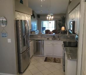 This second floor two bedroom plus den veranda has lots of updates including new stainless-steel appliances and new granite countertops in the