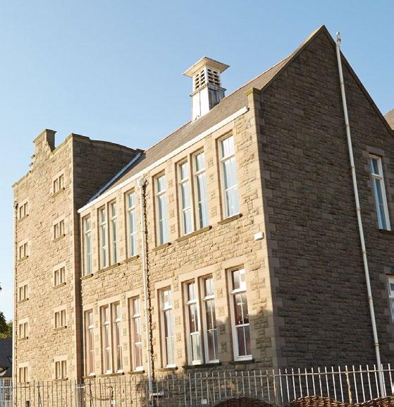 The original school building was constructed in 1911 to James H. Langlands designs, which pioneered the use of steel beams and placed them within traditional sandstone building materials.