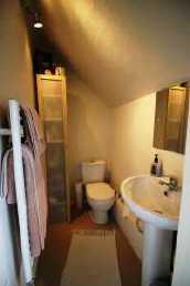 Door to: En Suite W.C With low level dual flush W.C, wash hand basin, heated towel rail.