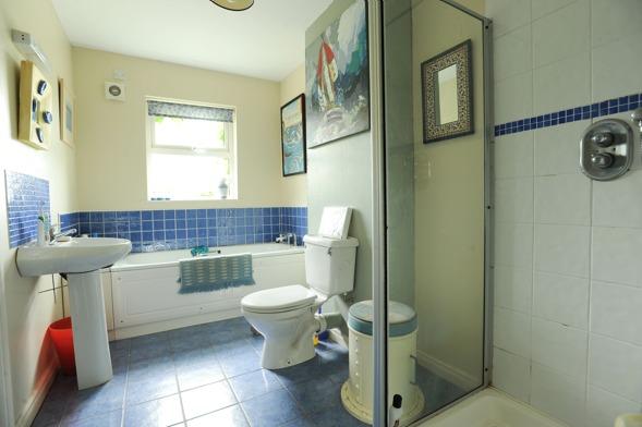 19m (3'11) White suite comprising pedestal wash hand basin with chrome mono mixer tap and tiled splashback; close coupled wc; ceramic tiled floor; 12 volt lighting.