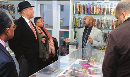 Alvin Benjamin Carter III shows the Hiphop Archive Research Institute to Ernest J. Wilson III. J. Cole in the Hiphop Archive.