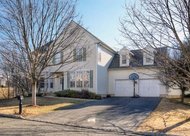 the Hills and Basking Ridge have to offer, with a tranquil location, with a deck that backs up to a wooded area.