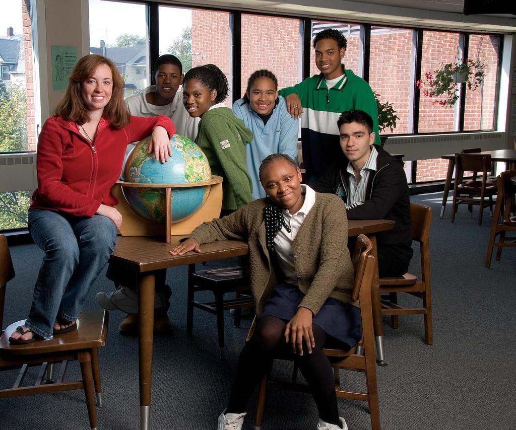 Working together at Fox Middle School are (from left) Jacqueline Nappi 09; eighth-graders Morgan Mitchell, Shauniqua Blake, Thomas Cruz, and Patricia Pipkin (seated); Andrew Mitchell 09 (standing);