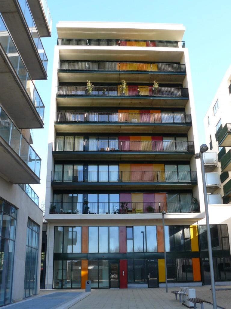 The building comprises 92 apartments, commercial units and underground parking The brightly coloured panels are steel storage units 2009 Anthony Reddy &