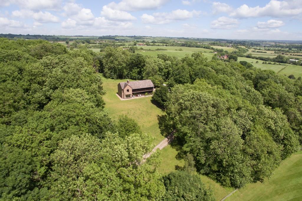 Timbers, Warwick Road Stratford Upon Avon CV37 0NR A rare opportunity to buy an exceptional property, with great potential and existing planning permission, in an elevated woodland setting.