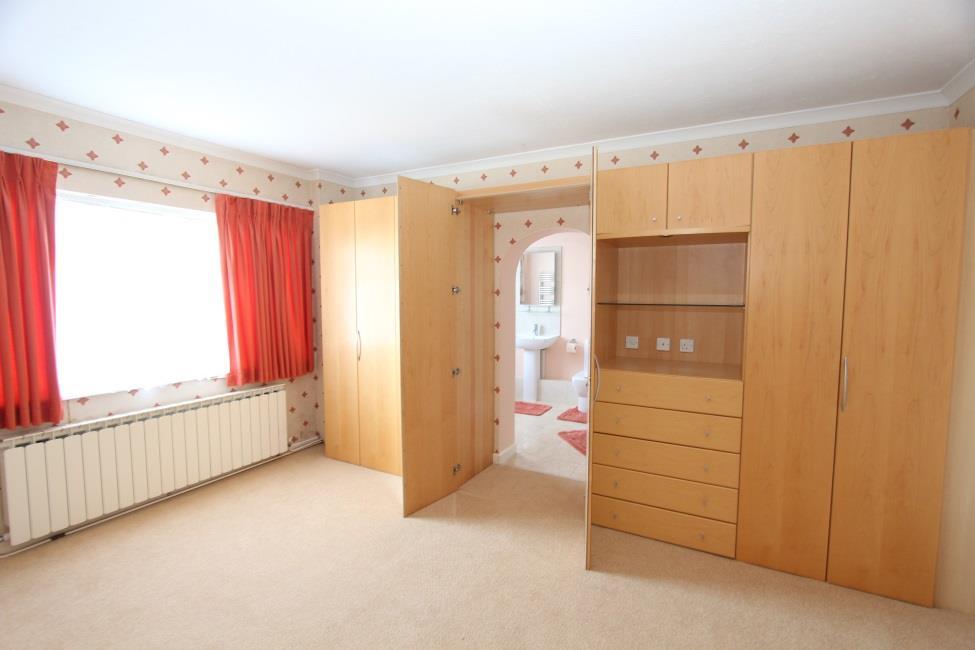 Bedroom 1 15 1 x 12 Built in bedroom furniture comprising two double wardrobes, drawers, overhead storage, shelving and