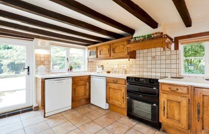 Breakfast Kitchen with base cupboards, drawers and wall cupboards, roll edge work surfaces, inset one and a half bowl sink, mixer tap, tiled splash backs, appliance spaces, plumbing for dishwasher,