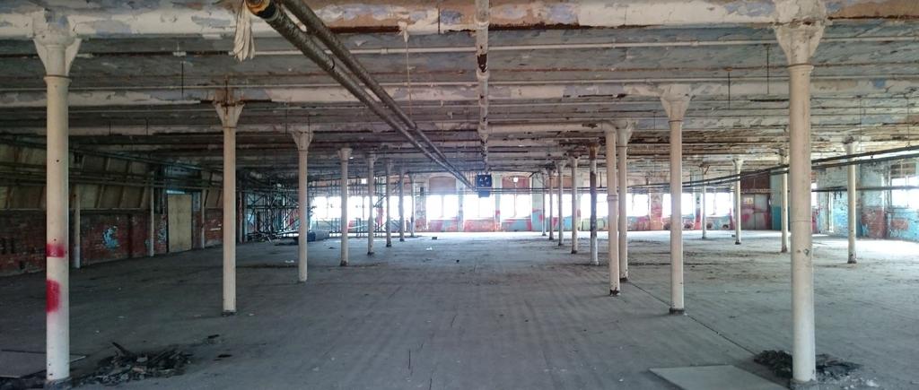 3 Existing Condition Existing Building The existing structure comprises cast iron columns and primary steel beams with brick aggregate concrete and steel