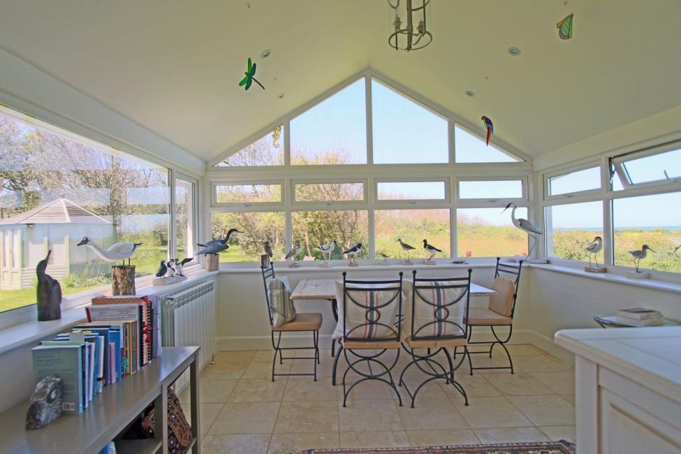 Sun lounge 12'8 x 12'4 Fabulous views on three elevations over the gardens, field to the