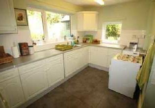 wall fitted kitchen cupboards, work surfaces over,